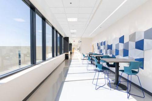 DCIH hallway with tables/chairs and window overlook